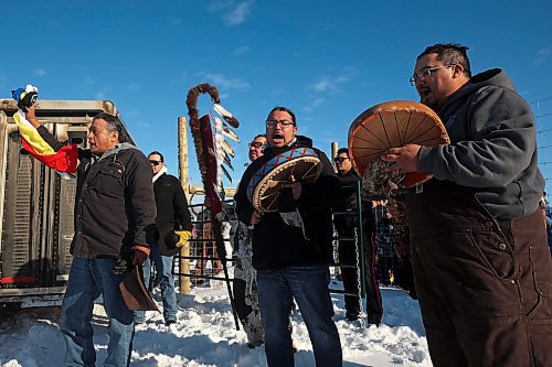 03122024
Birdtail Sioux First Nation elder Terry Wasteste says a prayer as drummers perform a song before 11 bison gifted to Birdtail by Sioux Valley Dakota Nation are released into their new enclosure at Birdtail on Tuesday. Students, elders, dignitaries and other community members all crowded around the enclosure to watch as the bison, including one white bison, entered their new home. White bison are considered sacred by many First Nations and bison as a whole hold special cultural and spiritual significance.   (Tim Smith/The Brandon Sun)