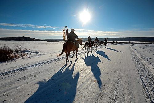 03122024
The Sioux Valley Dakota Nation Unity Riders lead the way to escort 11 bison (often referred to as buffalo in Dakota culture) through Birdtail Sioux First Nation to their new home in an enclosure in Birdtail&#x2019;s valley on Tuesday. The bison, including one white bison, were a gift to Birdtail from Sioux Valley. 
(Tim Smith/The Brandon Sun)