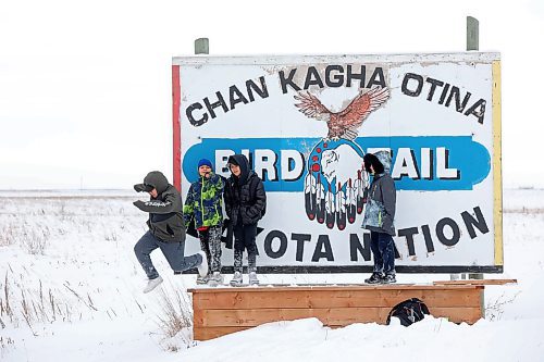 03122024
Students from Chan Kagha Otina Dakota Wayawa Tipi School at Birdtail Sioux First Nation play on the Birdtail sign on the eastern edge of the community while waiting for the bison from Sioux Valley Dakota Nation to arrive on Tuesday.
(Tim Smith/The Brandon Sun)