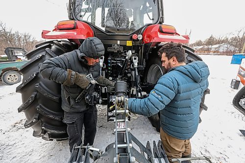MIKE DEAL / FREE PRESS
Laurie Penton, general manager of Windsor Park Nordic Centre, and Tristan Schneider, groomer at Windsor Park Nordic Centre, attach the trail grooming machine to the tracker Thursday afternoon preparing for the grand opening of the 2.5 km 'primary loop' along the Seine River on Saturday.
With new equipment and upgrades to the trail, the centre is better prepared for unpredictable weather due to climate change.
241205 - Thursday, December 5, 2024