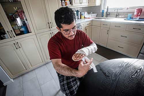 JOHN WOODS / FREE PRESS
Ariel Martes, who was robbed at gunpoint and attacked with a machete two weeks ago, is photographed as he attends to his wound in his home Sunday October 27, 2024. 

Reporter: ?