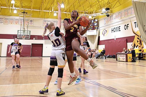 06122024
Rebecca Adiamo #2 of the Crocus Plainsmen leaps to take a shot on the net as Maddie Potter-Lukye #10 of the Virden Bears tries to block during their opening match in the Crocus Plains Early Bird Varsity Girls Basketball Tournament at CPRSS on Friday morning. 
(Tim Smith/The Brandon Sun)
