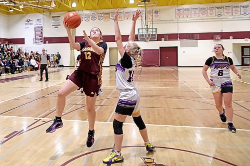 06122024
Madysyn Taillefer #12 of the Crocus Plainsmen leaps to take a shot on the net as Maddie Potter-Lukye #10 of the Virden Bears tries to block during their opening match in the Crocus Plains Early Bird Varsity Girls Basketball Tournament at CPRSS on Friday morning.
(Tim Smith/The Brandon Sun)