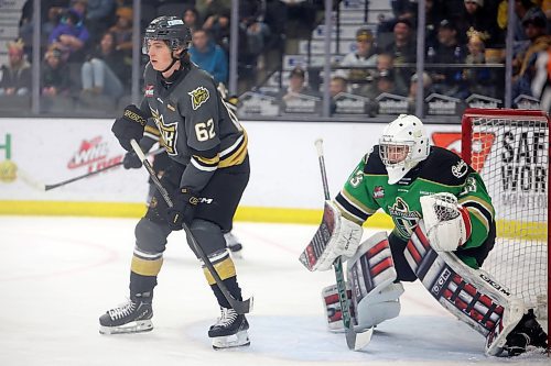 07122024
Nicholas Johnson #62 of the Brandon Wheat Kings eyes the play in front of goalie Dimitri Fortin #33 of the Prince Albert Raiders during WHL action at Westoba Place on Saturday evening. 
(Tim Smith/The Brandon Sun)