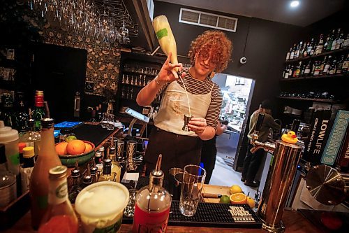 JOHN WOODS / FREE PRESS
Bonnie Day bartender Jade Janzen created two Christmas drinks, an alcoholic drink called Nogjito and a non-alcoholic drink called What's Up, Doc?. Janzen mixes a Nogjito Tuesday, December 3, 2024.
Reporter: av