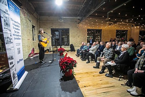 MIKAELA MACKENZIE / FREE PRESS
	
Madeleine Roger sings a few songs at the Winnipeg Free Press subscriber sip and shop event at The Forks on Monday, Dec. 2, 2024. 

Standup.
Winnipeg Free Press 2024