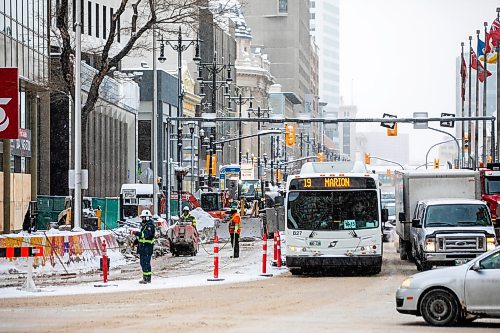 MIKAELA MACKENZIE / FREE PRESS
	
Construction workers at the south west corner of Portage and Main as the concrete barrier starts to get taken down on Tuesday, Dec. 10, 2024.


Winnipeg Free Press 2024