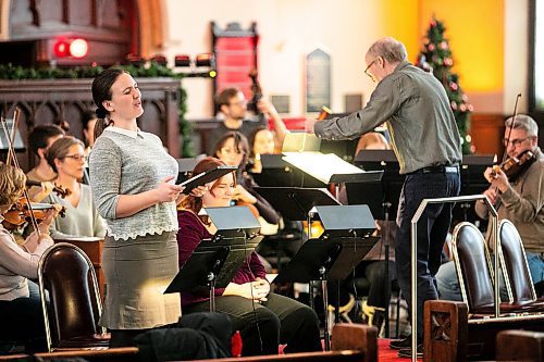 MIKAELA MACKENZIE / FREE PRESS
	
Soprano McKenzie Warriner sings with the Winnipeg Symphony Orchestra during a rehearsal for Handel's Messiah at Knox United Church on Tuesday, Dec. 10, 2024.


Winnipeg Free Press 2024