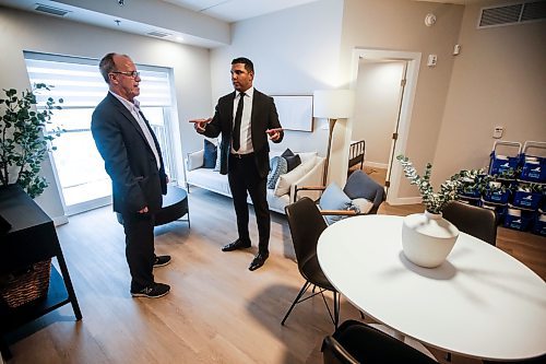 JOHN WOODS / FREE PRESS
Nigel Furgus, president and CEO of Paragon Living, right, shows city councillor Shawn Dobson around a suite at The Parkbridge, their new residential building at 2140 Portage Ave, Tuesday, December 10, 2024. 

Reporter: aaron