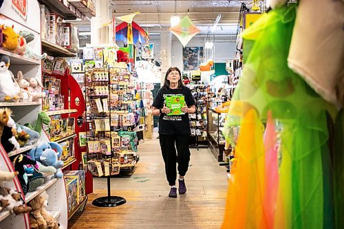 MIKAELA MACKENZIE / FREE PRESS
	
Sue Fonseca, who has worked at Toad Hall Toys for 20 years, shelves stock at the store on Wednesday, Dec. 11, 2024. The store is scrambling to adjust the computerized inventory management system ahead of the upcoming GST holiday.

For Scott Billeck story.
Winnipeg Free Press 2024