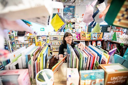 MIKAELA MACKENZIE / FREE PRESS
	
Sue Fonseca, book Toad, organizes and arranges the book selection at Toad Hall Toys on Wednesday, Dec. 11, 2024. The store is scrambling to adjust the computerized inventory management system ahead of the upcoming GST holiday.

For Scott Billeck story.
Winnipeg Free Press 2024