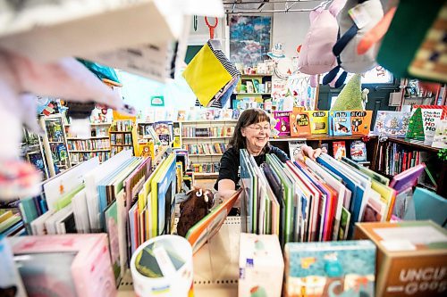 MIKAELA MACKENZIE / FREE PRESS
	
Sue Fonseca, book Toad, organizes and arranges the book selection at Toad Hall Toys on Wednesday, Dec. 11, 2024. The store is scrambling to adjust the computerized inventory management system ahead of the upcoming GST holiday.

For Scott Billeck story.
Winnipeg Free Press 2024