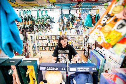 MIKAELA MACKENZIE / FREE PRESS
	
Sue Fonseca, book Toad, organizes and arranges the book selection at Toad Hall Toys on Wednesday, Dec. 11, 2024. The store is scrambling to adjust the computerized inventory management system ahead of the upcoming GST holiday.

For Scott Billeck story.
Winnipeg Free Press 2024