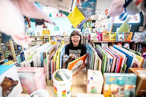 MIKAELA MACKENZIE / FREE PRESS
	
Sue Fonseca, book Toad, organizes and arranges the book selection at Toad Hall Toys on Wednesday, Dec. 11, 2024. The store is scrambling to adjust the computerized inventory management system ahead of the upcoming GST holiday.

For Scott Billeck story.
Winnipeg Free Press 2024