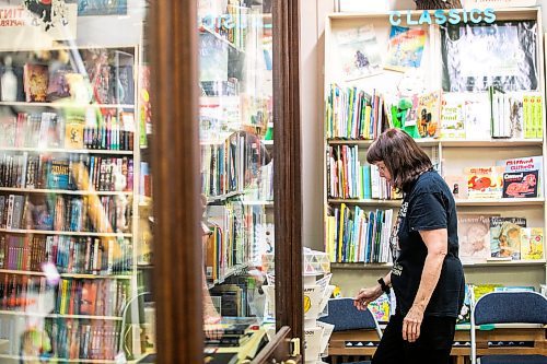 MIKAELA MACKENZIE / FREE PRESS
	
Sue Fonseca, book Toad, organizes and arranges the book selection at Toad Hall Toys on Wednesday, Dec. 11, 2024. The store is scrambling to adjust the computerized inventory management system ahead of the upcoming GST holiday.

For Scott Billeck story.
Winnipeg Free Press 2024