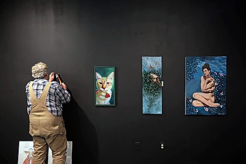 11122024
Kevin Conlin, Managing Director for the Art Gallery of Southwestern Manitoba, hangs some of the art work for the 20th Annual Members&#x2019; Show on Wednesday. The Members&#x2019; Show opens tonight in the AGSM Main Gallery alongside the opening reception for Tara Leach&#x2019;s exhibition The Eternal Question in the AGSM Kayes Community Gallery. Leach&#x2019;s exhibition opened on November 7 and runs until February 12, 2025. The Members&#x2019; Show runs until January 11, 2025.
(Tim Smith/The Brandon Sun)