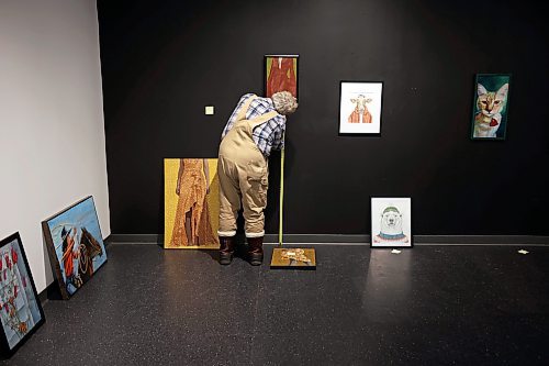 11122024
Kevin Conlin, Managing Director for the Art Gallery of Southwestern Manitoba, hangs some of the art work for the 20th Annual Members&#x2019; Show on Wednesday. The Members&#x2019; Show opens tonight in the AGSM Main Gallery alongside the opening reception for Tara Leach&#x2019;s exhibition The Eternal Question in the AGSM Kayes Community Gallery. Leach&#x2019;s exhibition opened on November 7 and runs until February 12, 2025. The Members&#x2019; Show runs until January 11, 2025.
(Tim Smith/The Brandon Sun)