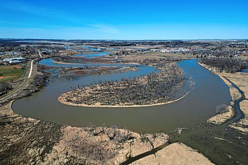 Water from the swollen Assiniboine River floods low-lying areas bordering the riverbanks in Brandon on Tuesday. As of Thursday morning, the province's interactive online flood map said the river had already peaked at most points from the Shellmouth Dam to Brandon, except near Virden where the peak was expected either Wednesday or Thursday. The river as measured at 18th Street in Brandon was at 1175.86 feet above sea level on Thursday. (Tim Smith/The Brandon Sun)