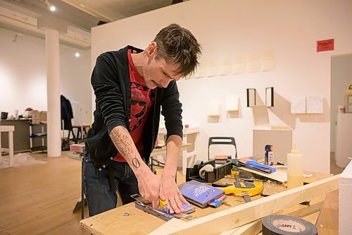 MIKE SUDOMA / FREE PRESS
Scott Fitzpatrick cuts DVD&#x2019;s with a. Box cutter to fit an exhibit display he&#x2019;s claiming will be the &#x201c;Largest DVD wall in Canada&#x201d; Thursday afternoon at Dave Barber Cinemateques Platform Gallery
December 12, 2024




