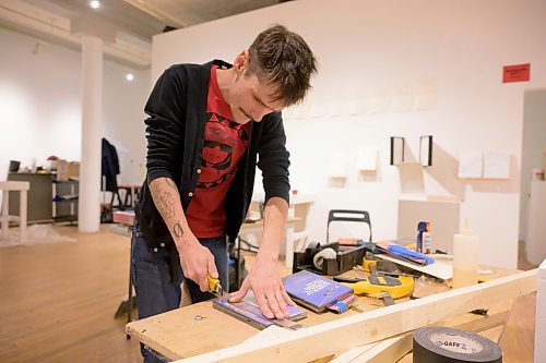 MIKE SUDOMA / FREE PRESS
Scott Fitzpatrick cuts DVD&#x2019;s with a. Box cutter to fit an exhibit display he&#x2019;s claiming will be the &#x201c;Largest DVD wall in Canada&#x201d; Thursday afternoon at Dave Barber Cinemateques Platform Gallery
December 12, 2024




