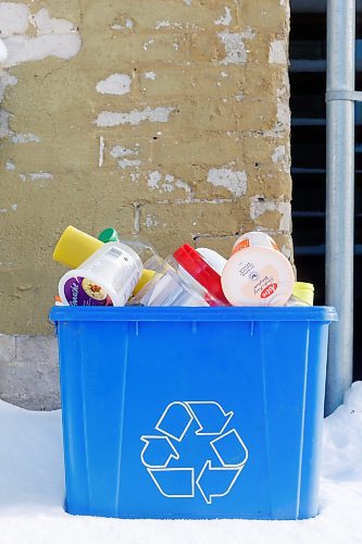 MIKE DEAL / FREE PRESS illustration 
A blue bin overflowing with plastic recyclables.
241212 - Thursday, December 12, 2024.