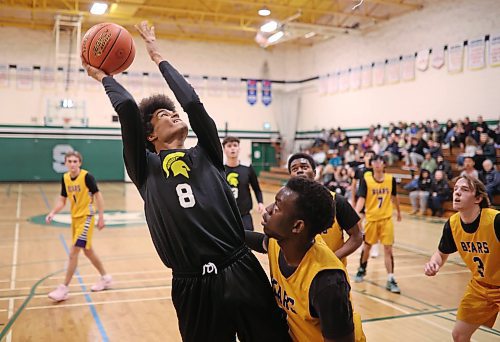 12122024
Kwali Taylor #8 of the Neelin Spartans leaps for a shot on net during the opening match against the Virden Golden Bears in the Brandon Sun Spartan Invitational varsity basketball tournament at &#xc9;cole Secondaire Neelin High School on Thursday.    (Tim Smith/The Brandon Sun)