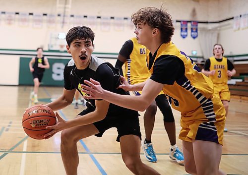 12122024
Kingston Thomas #5 of the Neelin Spartans looks for a way  around Preston Studer #33 of the Virden Golden Bears during the opening match of the Brandon Sun Spartan Invitational varsity basketball tournament at &#xc9;cole Secondaire Neelin High School on Thursday.    (Tim Smith/The Brandon Sun)