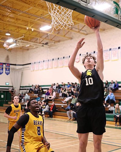 12122024
Ethan Olson #10 of the Neelin Spartans leaps for a shot on net during the opening match against the Virden Golden Bears in the Brandon Sun Spartan Invitational varsity basketball tournament at &#xc9;cole Secondaire Neelin High School on Thursday.    (Tim Smith/The Brandon Sun)