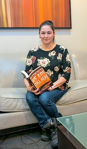 BROOK JONES/FREE PRESS
Crystal Gail Fraser who is an associate professor in history and native studies at the University of Alberta in Edmonton, Alta., holds a copy of By Strength We Are Still Here which she wrote and was published by the University of Manitoba Press. Fraser was pictured in the lobby of the Hilton Winnipeg Airport Suites in Winnipeg, Man., Thursday, Dec. 12, 2024.