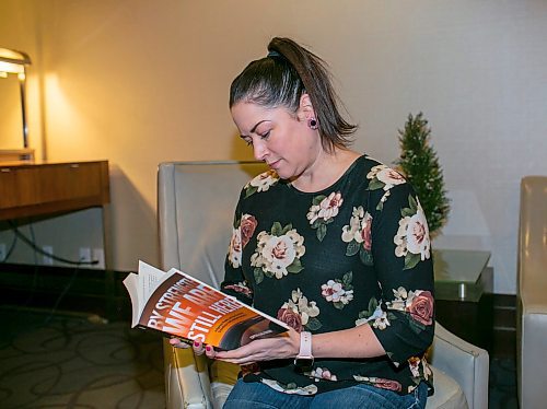 BROOK JONES/FREE PRESS
Crystal Gail Fraser who is an associate professor in history and native studies at the University of Alberta in Edmonton, Alta., reads a copy of By Strength We Are Still Here which she wrote and was published by the University of Manitoba Press. Fraser was pictured in the lobby of the Hilton Winnipeg Airport Suites in Winnipeg, Man., Thursday, Dec. 12, 2024.