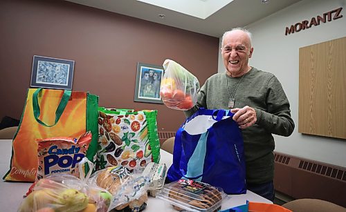 RUTH BONNEVILLE / FREE PRESS
Volunteer Column
Photo of Barry Weber as he packs hampers at the Jewish Community Centre Thursday.
Subject: Barry Weber, volunteer with the Hanukkah food program organized by B'nai Brith Canada and Jewish Child and Family Service. Volunteers package and deliver parcels to some of the Jewish communityճ most vulnerable members, including seniors, Holocaust survivors, widows and widowers, and individuals with disabilities.
This is for my Dec. 16 volunteers column.
See story by Aaron
Dec 12th, 2024