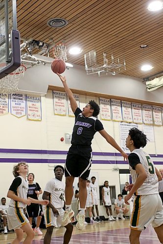 Vincent Massey's Knox Smith rises for a layup against Miles Macdonell during their Friday morning game. (Thomas Friesen/The Brandon Sun)