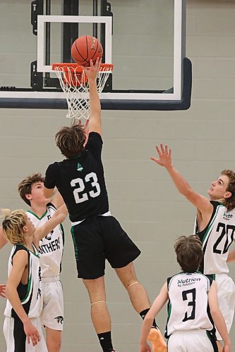 Dauphin's Ronin Mouck (23) tips in a layup against Glenboro in Friday action at the Healthy Living Centre. (Matt Packwood/The Brandon Sun)