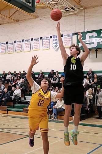 Neelin's Ethan Olson (10) jumps for a shot in BSSI action at Neelin on Friday afternoon. (Matt Packwood/The Brandon Sun)