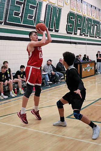 Source for Sports division tournament MVP Ethan Wiebe of Garden Valley takes a shot over Neelin's Kwali Taylor in the final. (Matt Packwood/The Brandon Sun)