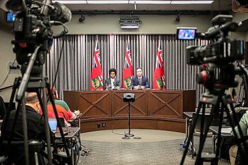 MIKAELA MACKENZIE / FREE PRESS
	
Health minister Uzoma Asagwara (left) and finance minister Adrien Sala give a provincial fiscal update at the Manitoba Legislative Building on Monday, Dec. 16, 2024.

For Maggie story.
Winnipeg Free Press 2024