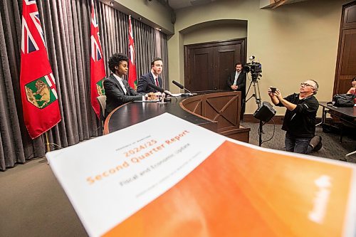 MIKAELA MACKENZIE / FREE PRESS
	
Health minister Uzoma Asagwara (left) and finance minister Adrien Sala give a provincial fiscal update at the Manitoba Legislative Building on Monday, Dec. 16, 2024.

For Maggie story.
Winnipeg Free Press 2024