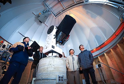 RUTH BONNEVILLE / FREE PRESS

Local  - Remote Observatory!

Photo of lead graduate student Ryan Wierckx (lwith laptop), assistant professor Tyrone Woods, and new graduate students, Jade Yeung (behind pillar)
Charles Lee and Mark Pirgalinat, at the Glenlea Remote Observatory during Grand Opening Tuesday. 

Story: 
Grand opening of the University of Manitoba's Remote Observatory in the Glenlea area.   The new observatory consists of an ASH dome and a PlaneWave CDK350 telescope. 

For the first time at the University of Manitoba, both the dome and the telescope have the capability of being controlled remotely, meaning that students can observe from anywhere as long as they have an internet connection.

This new Observatory was  built by Ryan Wierckx (lead) U of M graduate student with the assistance of Tyrone Woods (Assistant Professor) and staff. 



Dec 17th, 2024