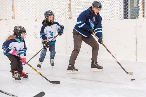 MIKE DEAL / FREE PRESS
Mayor Scott Gillingham tries to keep a puck away from Anna (left), 7, and Matthew, 9, on one of the rinks at the Corydon Community Centre – Sir John Franklin site (1 Sir John Franklin Rd.) after announcing that thirteen City-owned community centres will receive funding for renovations through the City of Winnipeg’s Community Centre Renovation Grant Program (CCRGP).
Standup
241217 - Tuesday, December 17, 2024.