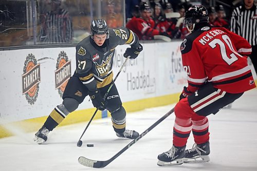 Luke Shipley (27) plays the puck against Moose Jaw Warriors on Tuesday evening.
(Tim Smith/The Brandon Sun)