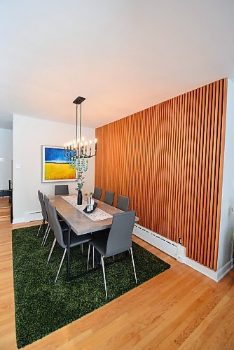 Todd Lewys / Free Press
Mid-century-modern style is alive and well in the dining room, which is defined smartly by a custom wood-slat feature wall.