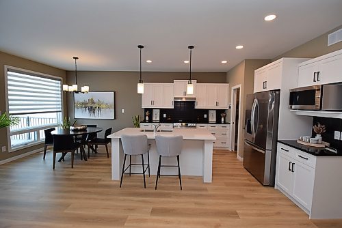 Todd Lewys / Free Press
The beautifully-finished island kitchen opens perfectly onto the bright, well-positioned eating area.