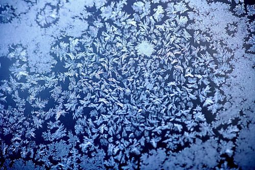 Frost patterns decorate a porch window pane on 15th Street following overnight temperatures that dipped below -20 C this week. But the temperature is set to rise overnight with a forecast of -9 C by 8 a.m. Friday morning in Brandon, and a high of -2 C, with a further high of 2 C on Saturday. (Matt Goerzen/The Brandon Sun)