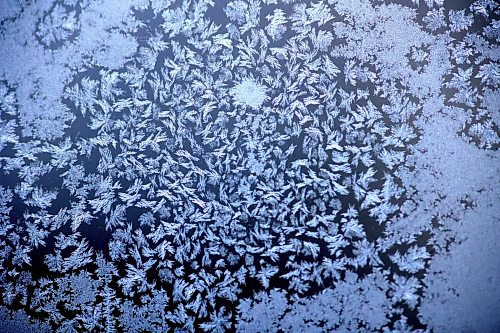 Frost patterns decorate a porch window pane on 15th Street following overnight temperatures that dipped below -20 C this week. But the temperature is set to rise overnight with a forecast of -9 C by 8 a.m. Friday morning in Brandon, and a high of -2 C, with a further high of 2 C on Saturday. (Matt Goerzen/The Brandon Sun)