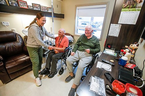 JOHN WOODS / FREE PRESS
Cherry Ponc, nurse, is photographed with residents Wilhelm Funk, right, and David Sawatzky  at the Heritage Life Personal Care Home Tuesday, December 17, 2024. Rural care homes often face a lack of capacity - either short beds, short staff or both.

Reporter: gabby