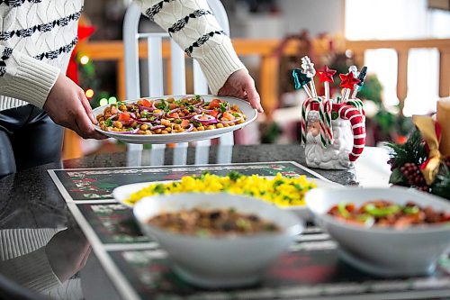 MIKAELA MACKENZIE / FREE PRESS
	
Chickpea salad (back), lentils with mushrooms (front left), and Manchurian soya (front right), served with basmati rice, on Monday, Dec. 9, 2024. These are all options for plant-based proteins in holiday meals.

For Romona story.
Winnipeg Free Press 2024