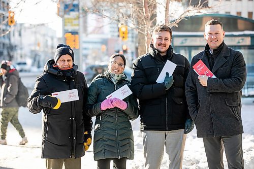 MIKAELA MACKENZIE / FREE PRESS
	
Steve Bagel (left), Elena Anciro, Matthew Samyn, and Brandon Boone get ready to hand-deliver a thank-you note to IG Wealth Management on Wednesday, Dec. 18, 2024.

For Koralee story.
Winnipeg Free Press 2024