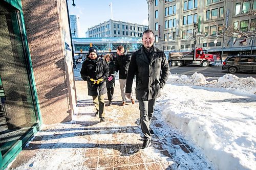 MIKAELA MACKENZIE / FREE PRESS
	
Steve Bagel (left), Elena Anciro, Matthew Samyn, and Brandon Boone (front) walk to hand-deliver a thank-you note to IG Wealth Management on Wednesday, Dec. 18, 2024.

For Koralee story.
Winnipeg Free Press 2024