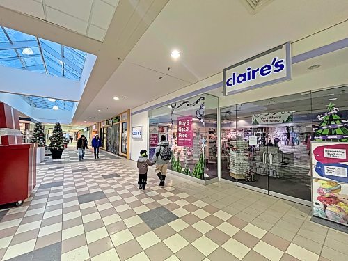 Shoppers walk past the closed store fronts of Claire's and the Hair Today Mall Barbers at the Brandon Shoppers Mall on Wednesday. Several businesses have been closed following an incident on Monday morning that prompted the evacuation of the mall and a visit from Brandon Fire and Emergency Services. (Matt Goerzen/The Brandon Sun)