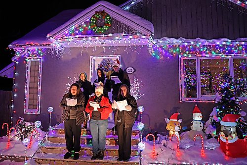 18122024
Singers with the Neelin Chamber Choir and Neelin Simple Green perform Christmas carols outside Patrick Stewart&#x2019;s brightly decorated home in the 500 block of 22nd Street in Brandon on a cold Wednesday evening. Stewart is collecting donations of food or cash for One At A Time Rescue, a local organization for orphaned animals.
(Tim Smith/The Brandon Sun)